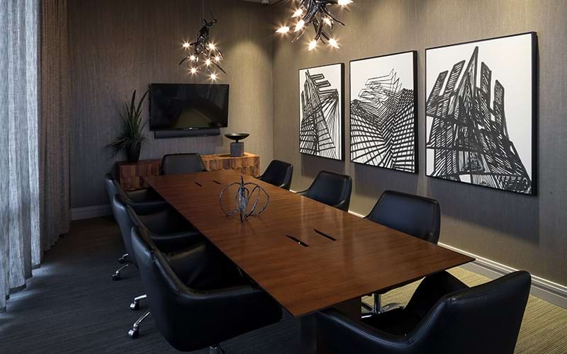 Large meeting room with long wooden table 